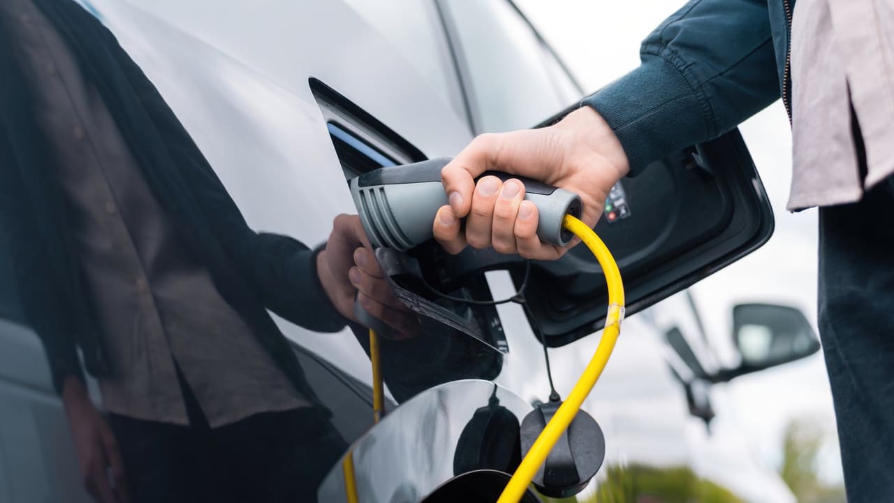 A charging cable plugged into an electric car